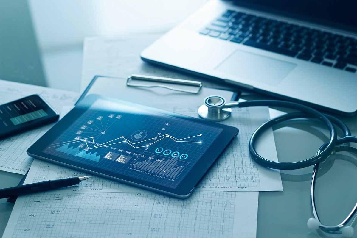 Tablet with medical data next to a stethoscope